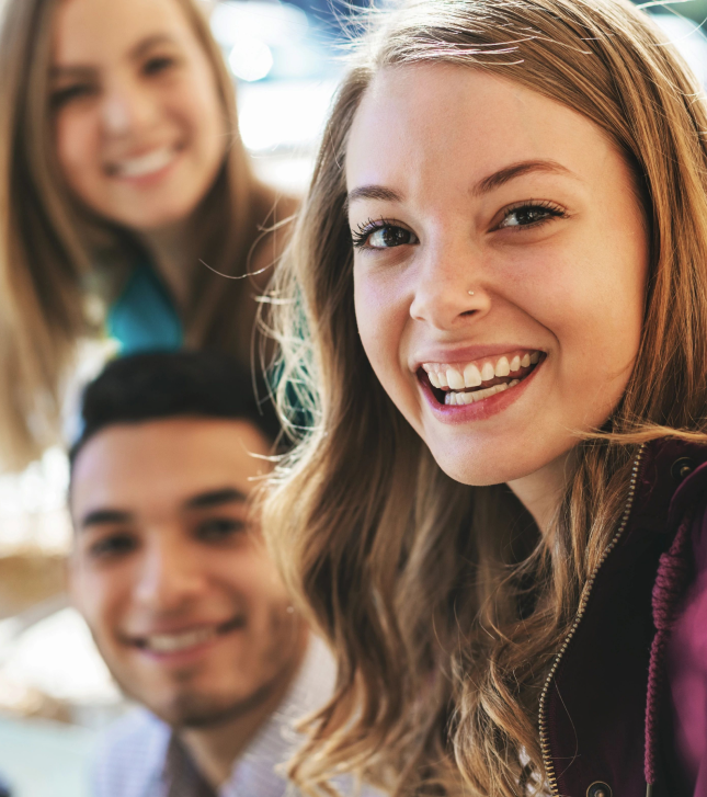 Three smiling people