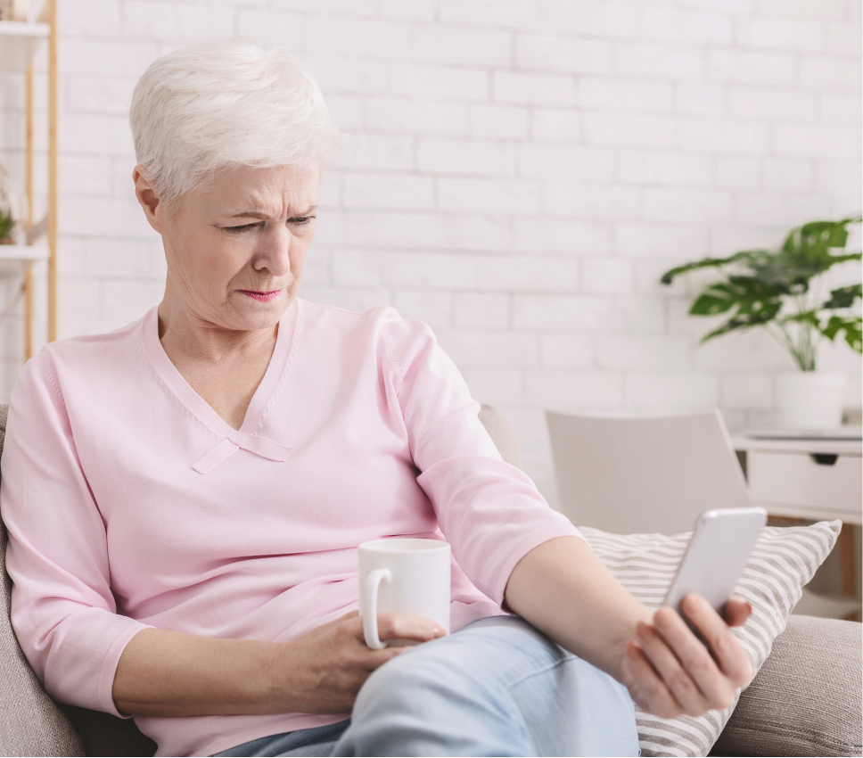 elderly woman with phone in hand