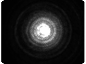 Black background with a bright light in the middle, showing the largest halo around the light compared to the three other images, representing the optical bench halo measurement for ZEISS AT LARA Diffractive EDF IOL.