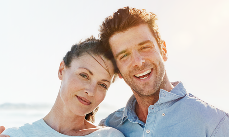 Smiling couple on the beach